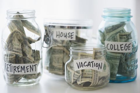 Close up of savings jars with money