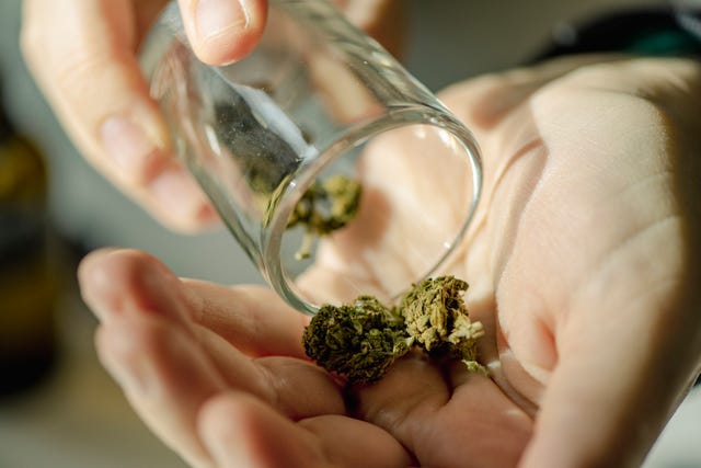 close up of senior woman using cannabis at home