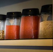 Close-Up Of Shelf With Jars Of Spices