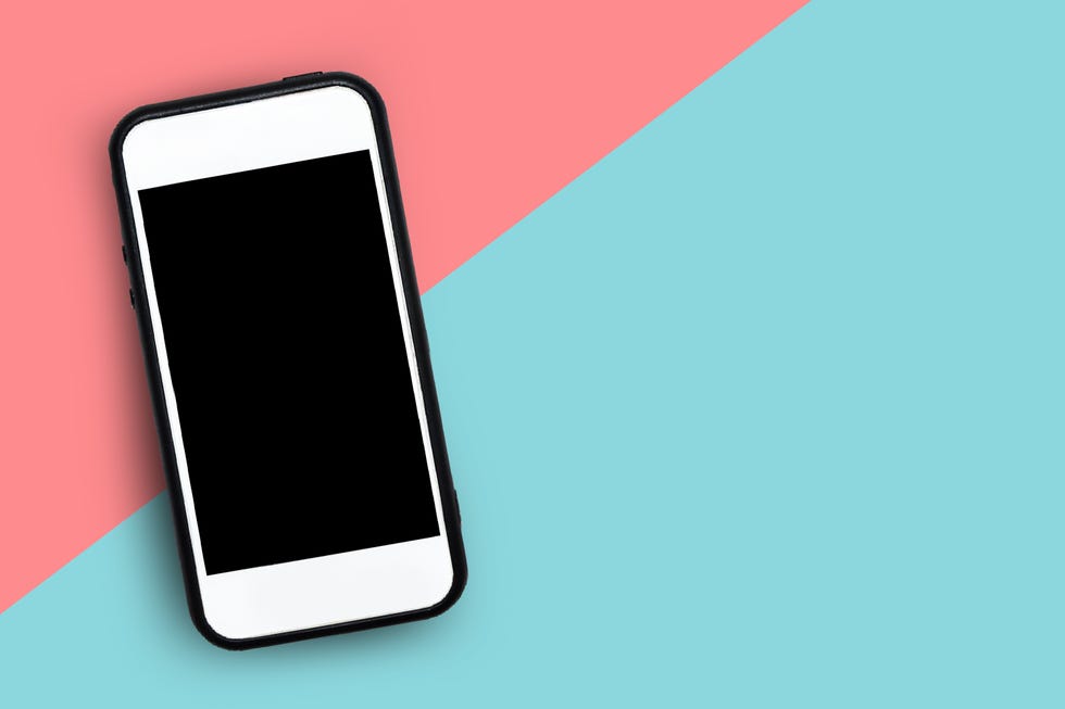 closeup of smart phone over colored background