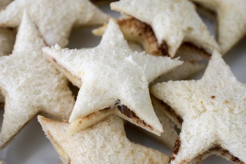 close up of star sandwiches filled with hazelnut spread