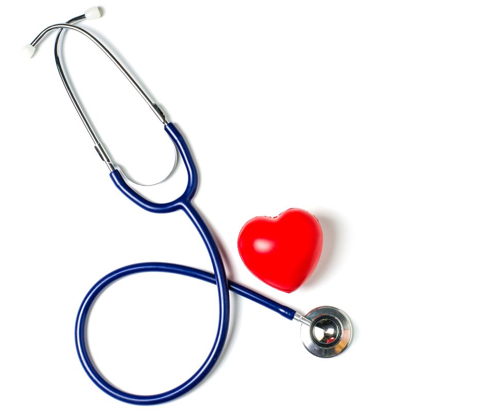 Close-Up Of Stethoscope And Heart Shape On White Background