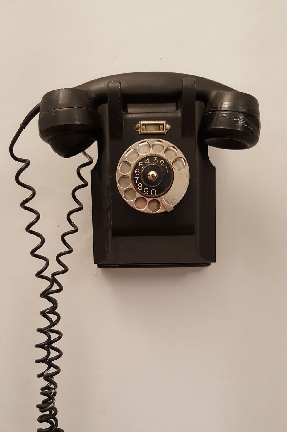 Close-Up Of Telephone On Wall