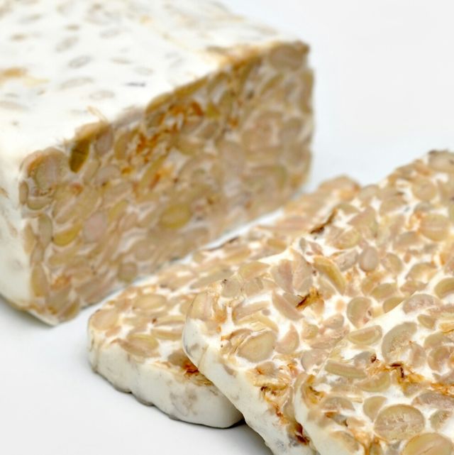 close up of tempeh on white background