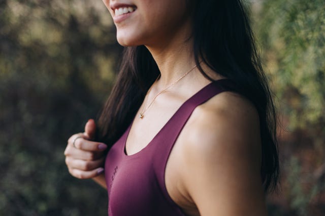 close up of the shoulder section of a young hispanic woman in sports clothing