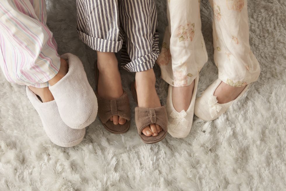 three women wearing slippers