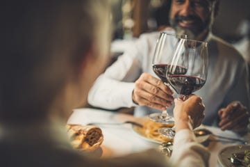 close up of toasting with wine in a restaurant