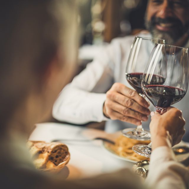 close up of toasting with wine in a restaurant