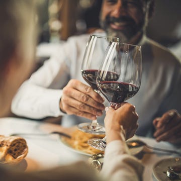 close up of toasting with wine in a restaurant