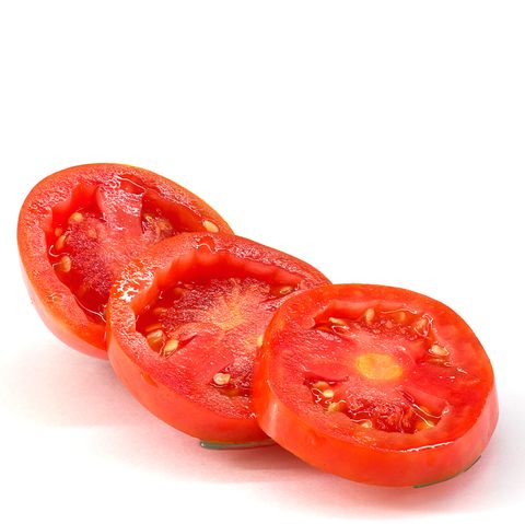 closeup of tomato slices over white background
