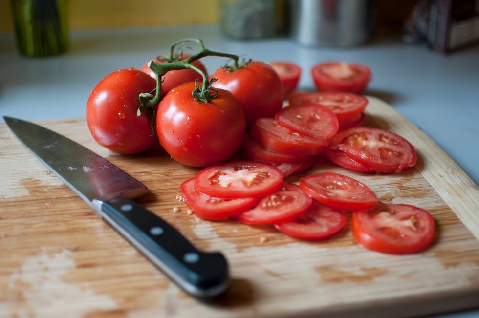 close up of tomatoes on cutting board