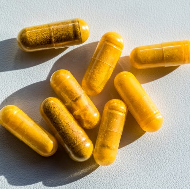 Close-up of turmeric capsules on table close up of turmeric capsules on table