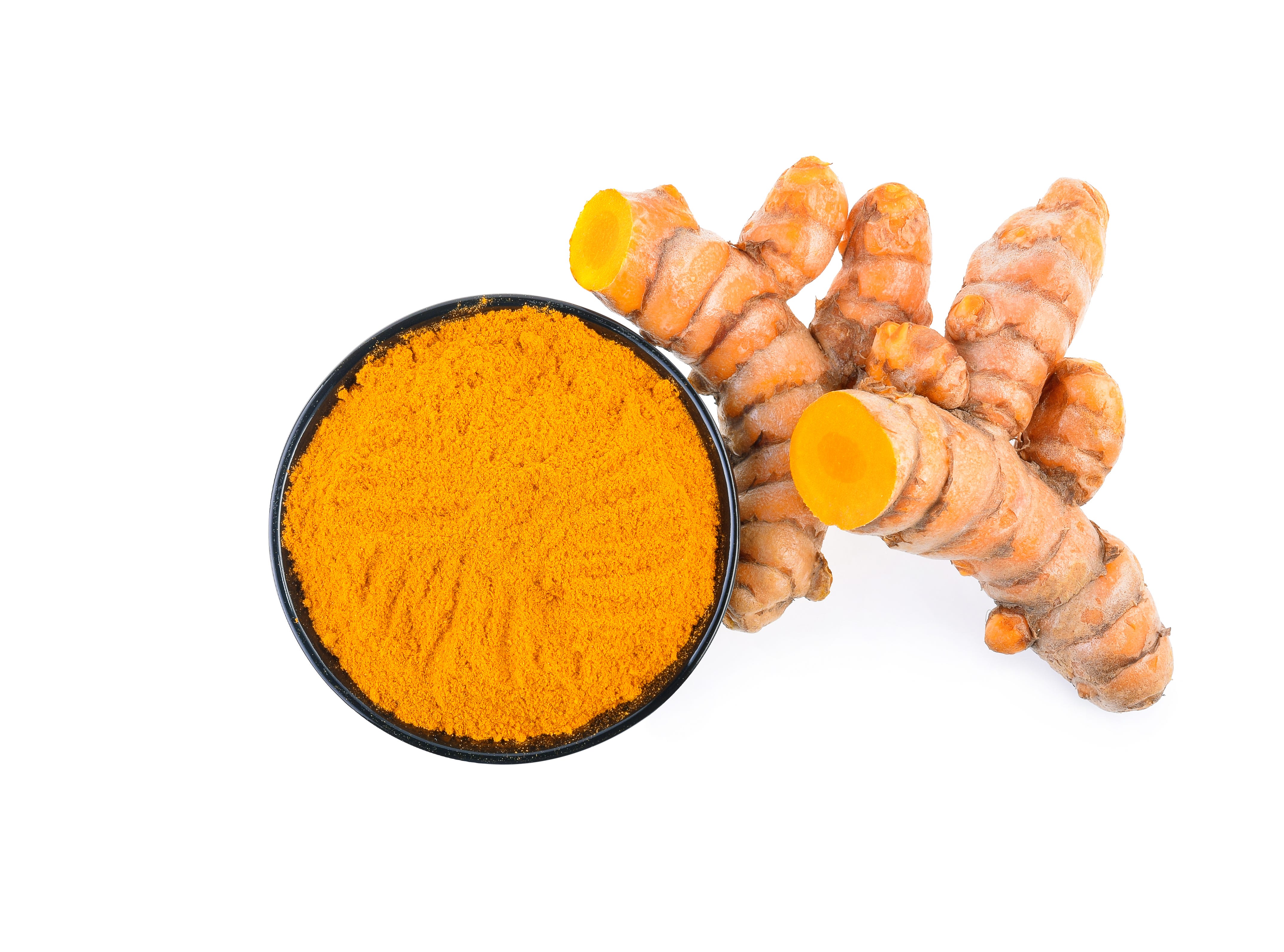 Close-Up Of Turmeric Over White Background