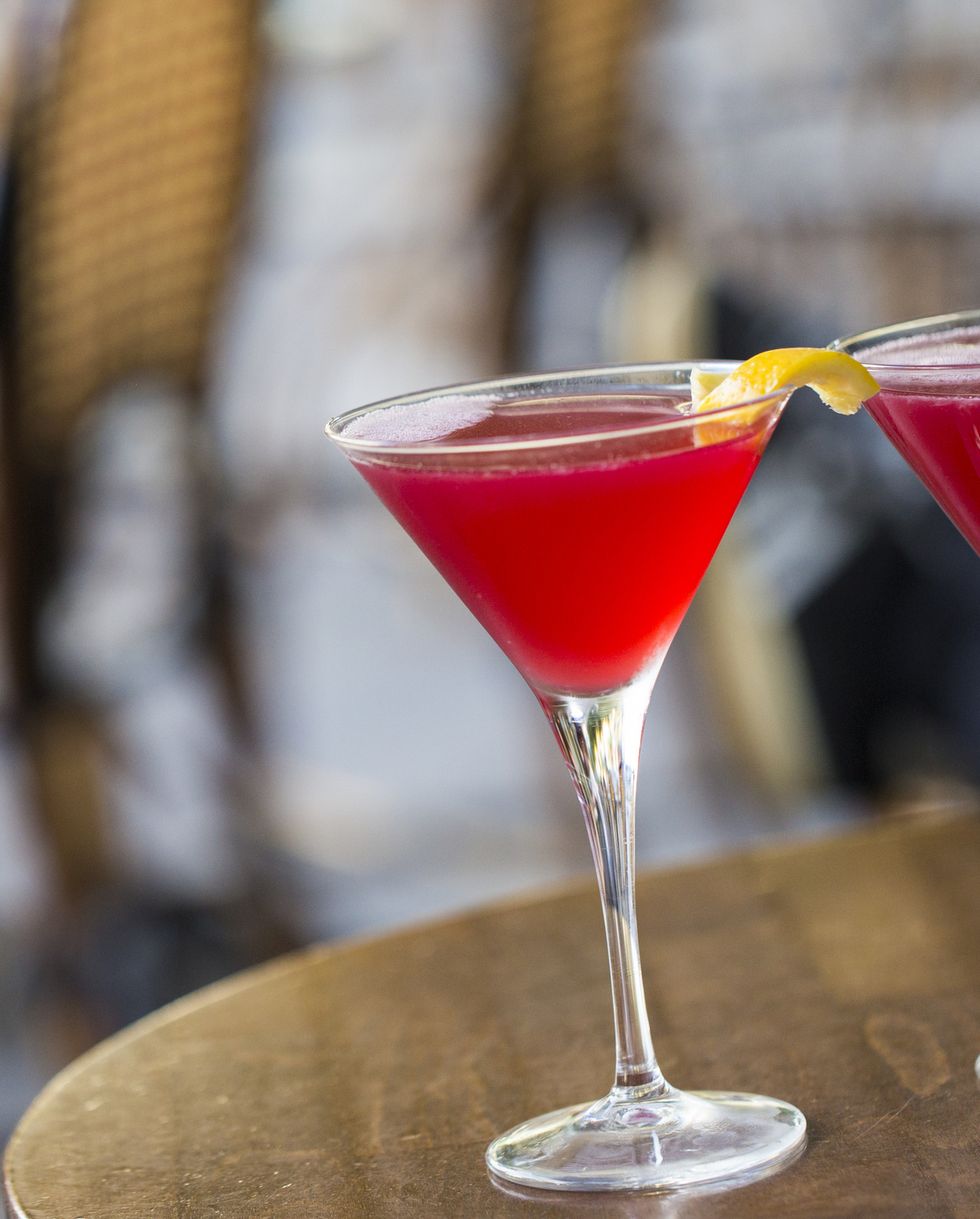 close up of two cosmopolitan martinis on a paris sidewalk bar patio