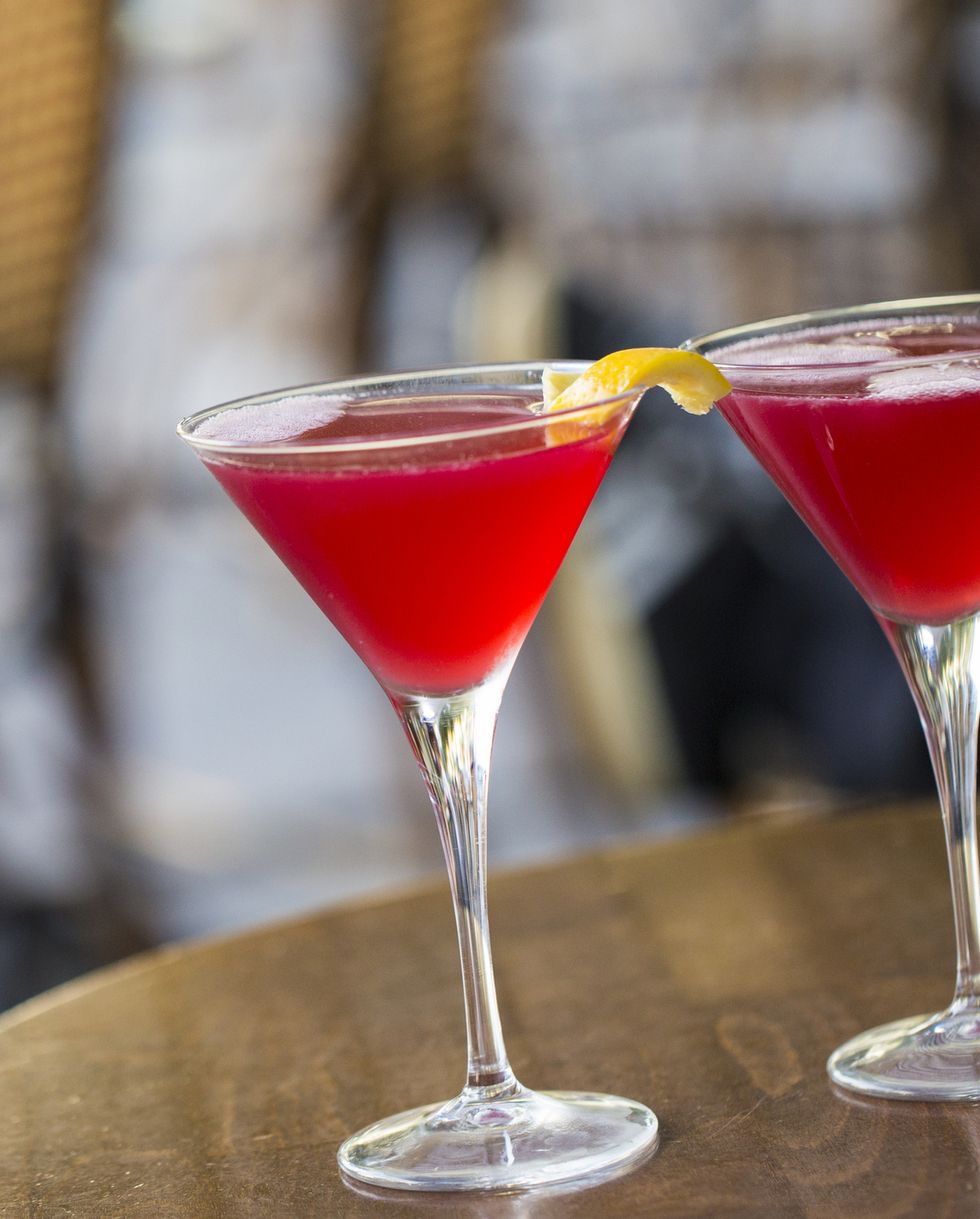 close up of two cosmopolitan martinis on a paris sidewalk bar patio