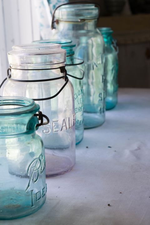Close-Up Of Various Jars On Table