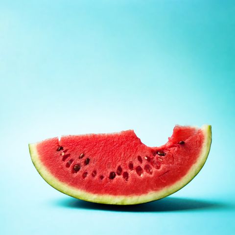 close up of water melon slice against blue background
