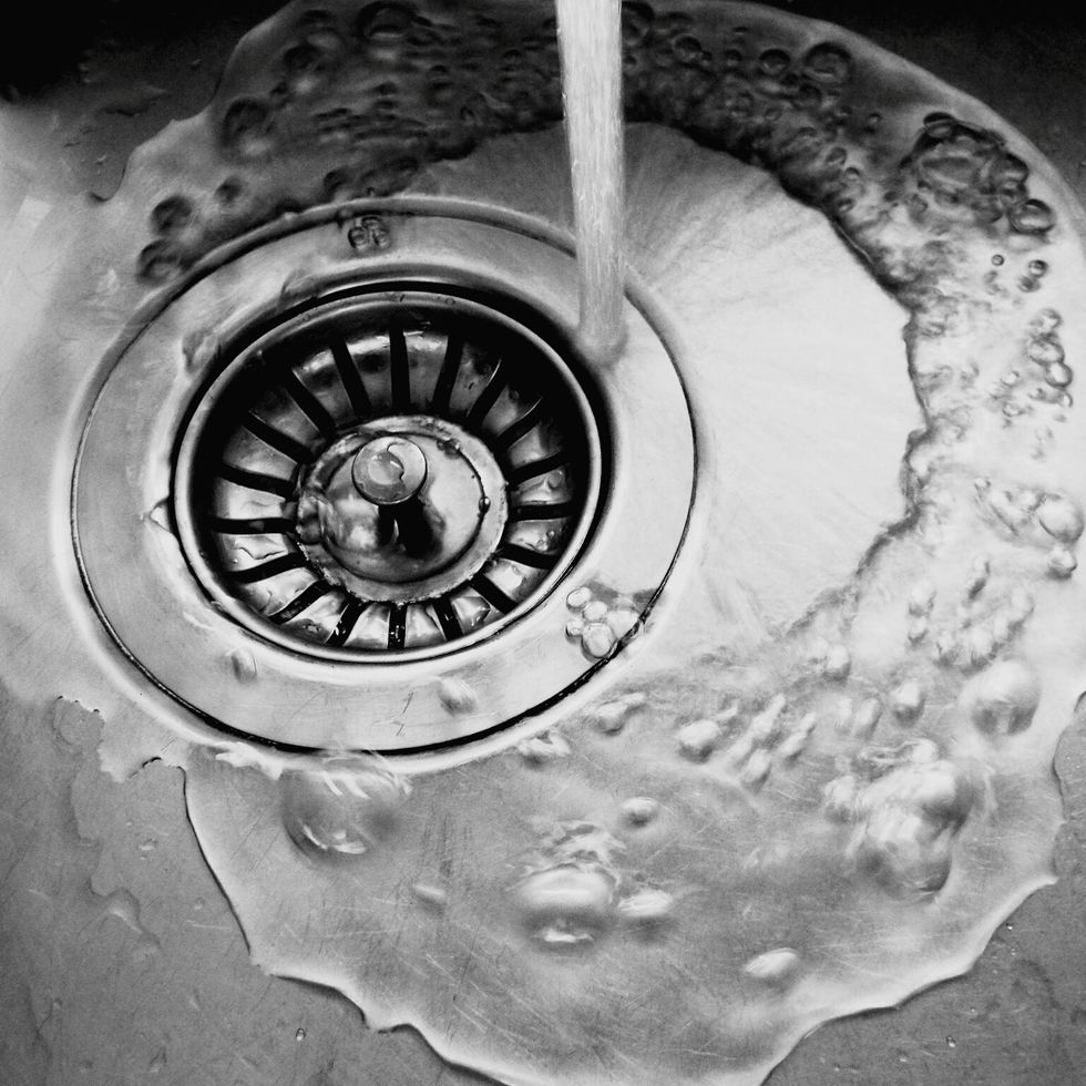 close up of water running on sink