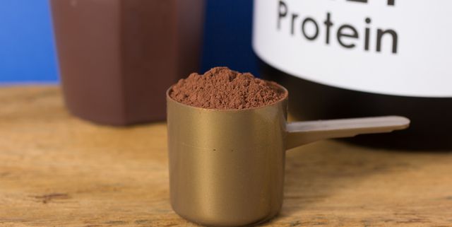 Close-Up Of Whey Protein In Spoon On Table