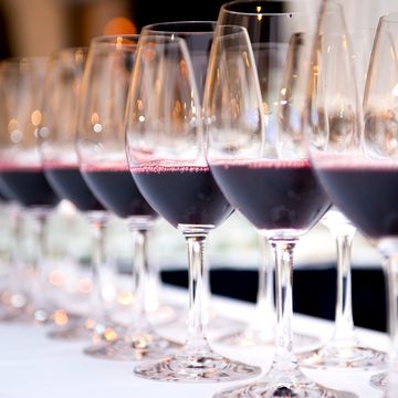 Close-Up Of Wineglass In Row On Table
