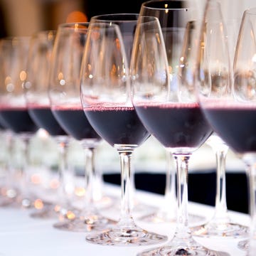 Close-Up Of Wineglass In Row On Table