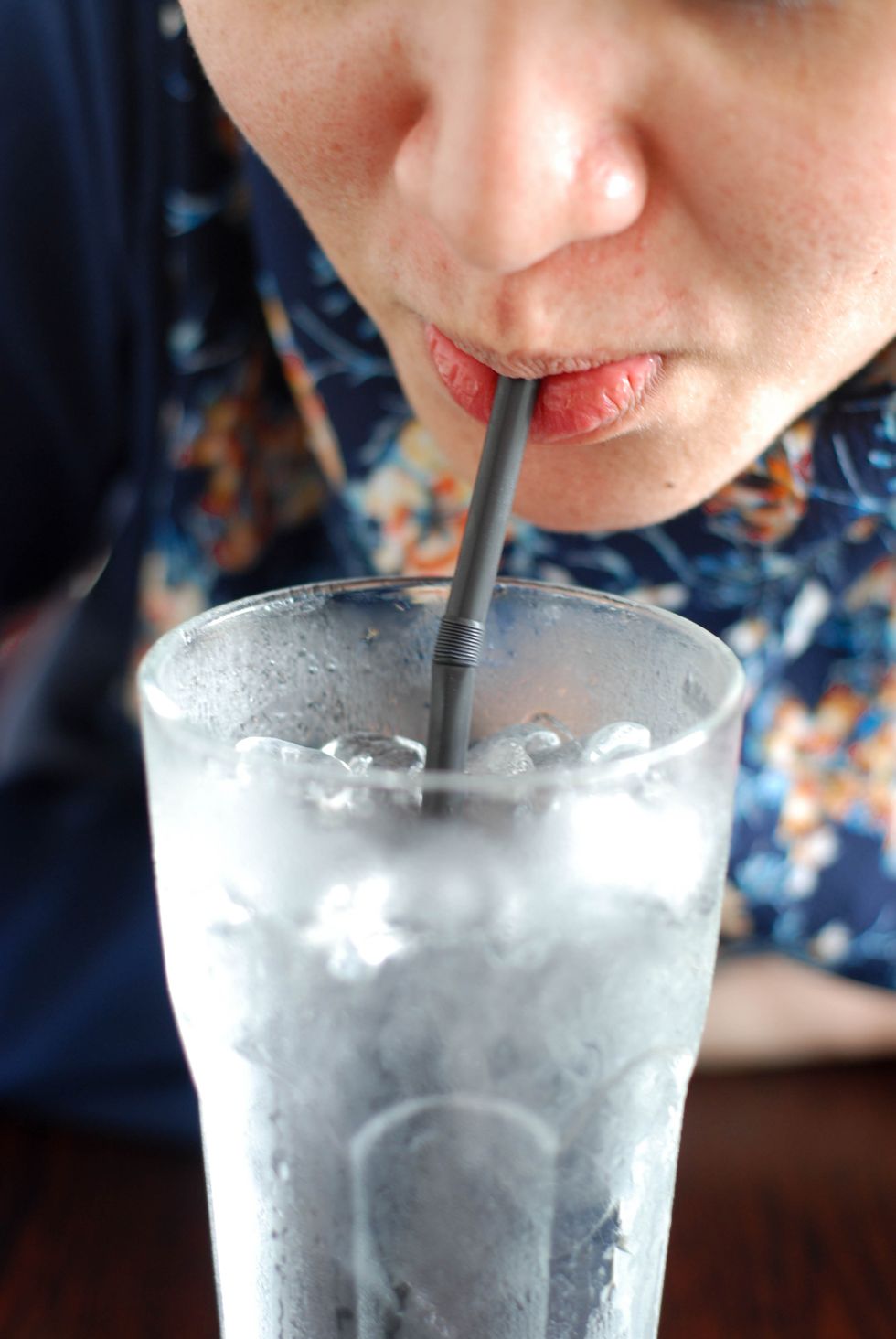 close up of woman drinking cold water