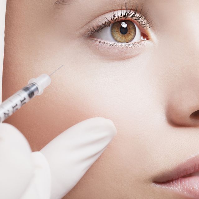 close up of woman receiving botox injection under eye