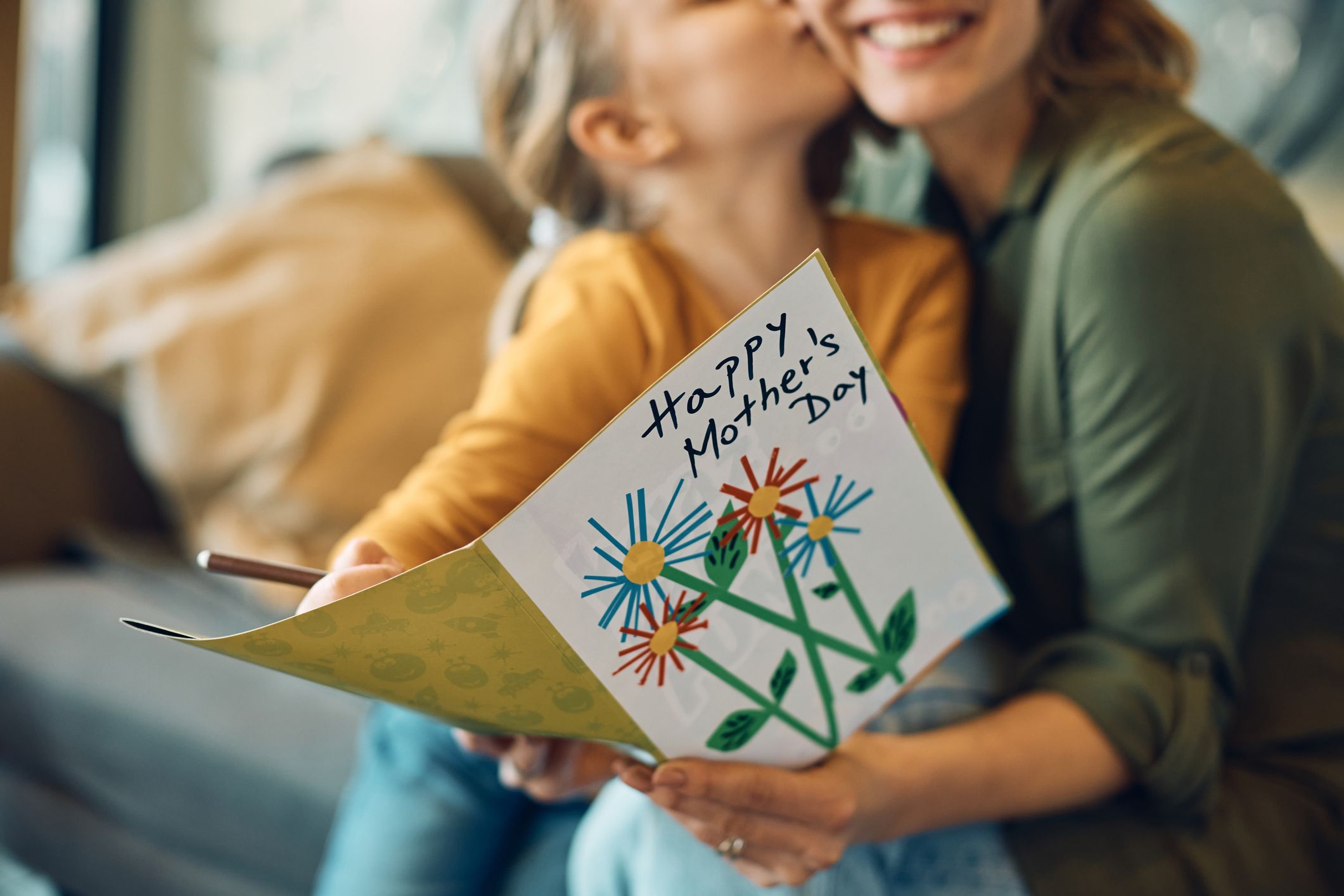 https://hips.hearstapps.com/hmg-prod/images/close-up-of-woman-receiving-mothers-day-greeting-royalty-free-image-1680728374.jpg