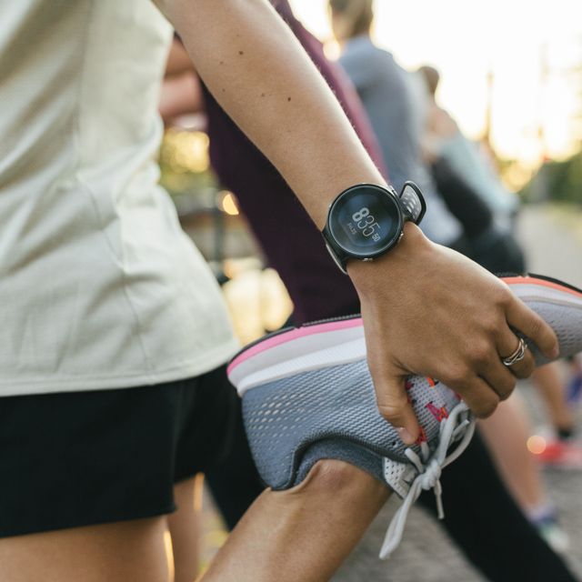 close up of woman stretching before run