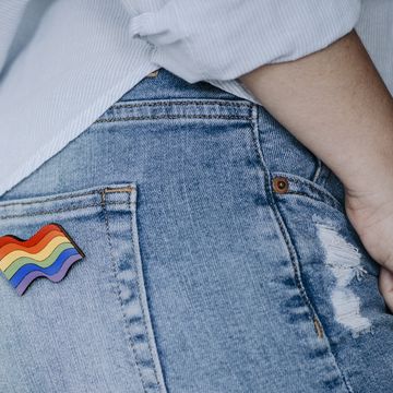 close up of woman wearing rainbow badge