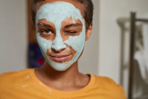 close up of woman winking at home