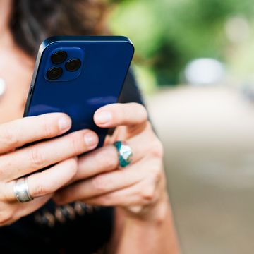 close up of woman with smartphone