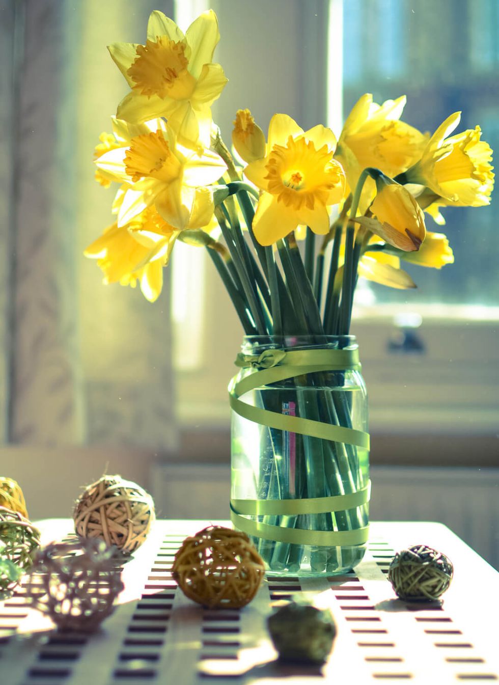 Close-Up Of Yellow Flowers In Vase On Table