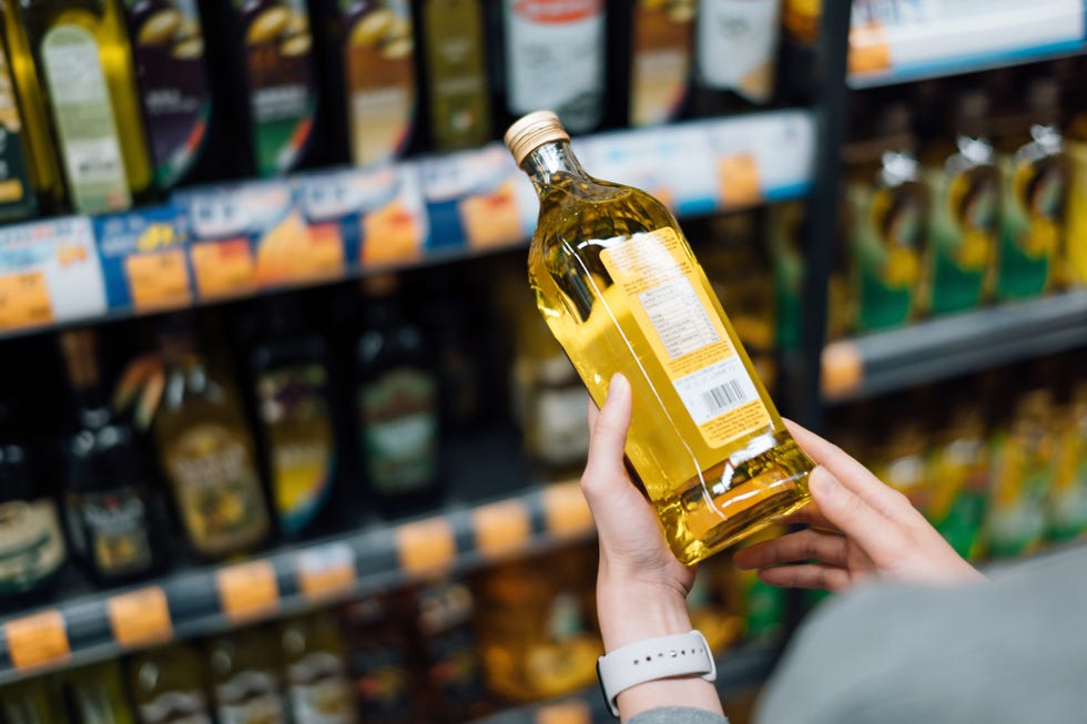 close up of young woman grocery shopping in a royalty free image 1713443062