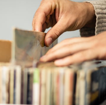 Close up on hands browsing record store