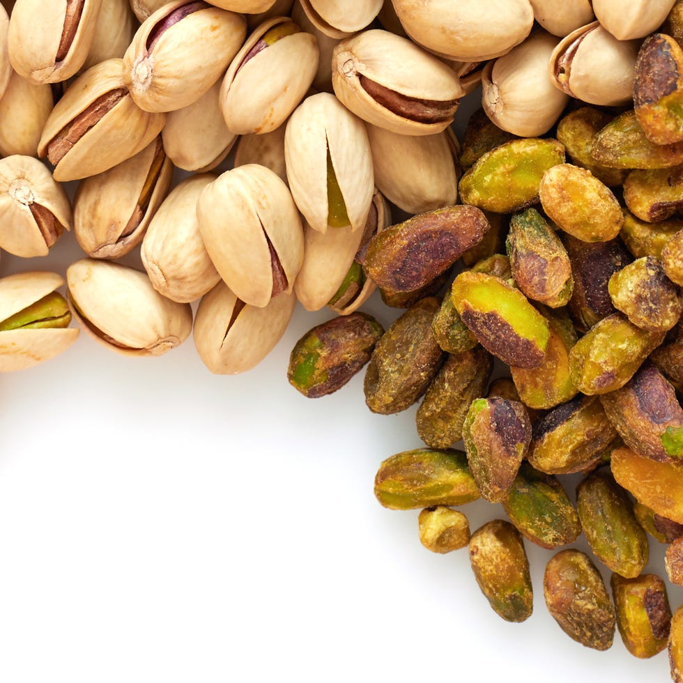 close up on pistachios on white background