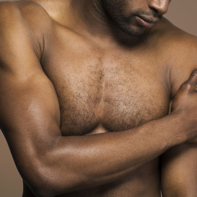 close up on torso of dark skinned athletic male