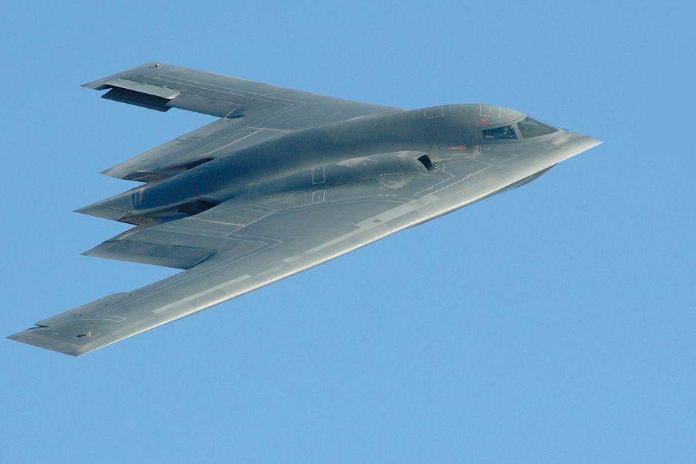 closeup photo of a b2 stealth bomber in flight