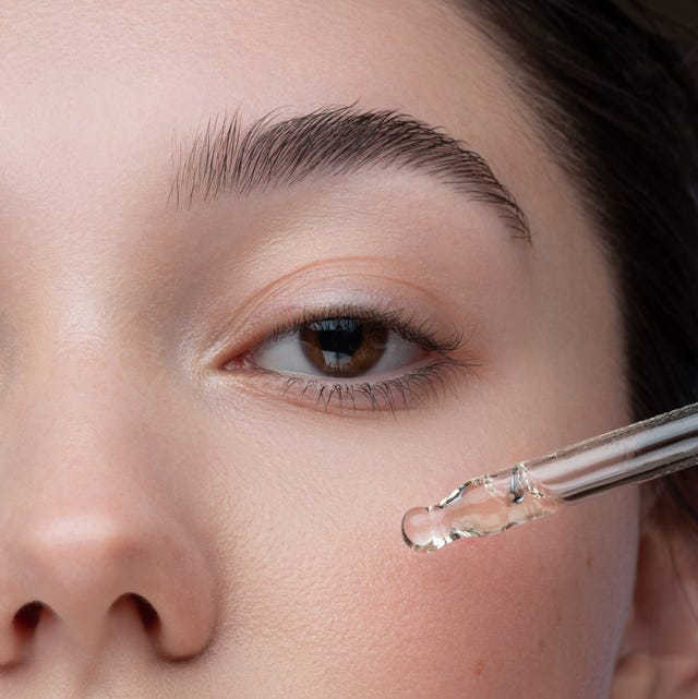 Close-up portrait of beautiful girl getting skin anti aging treatment best eye serums