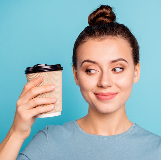 close up portrait of her she nice looking attractive lovely winsome cheerful foxy content girl holding in hands hot sweet coffee take away isolated over bright vivid shine turquoise background