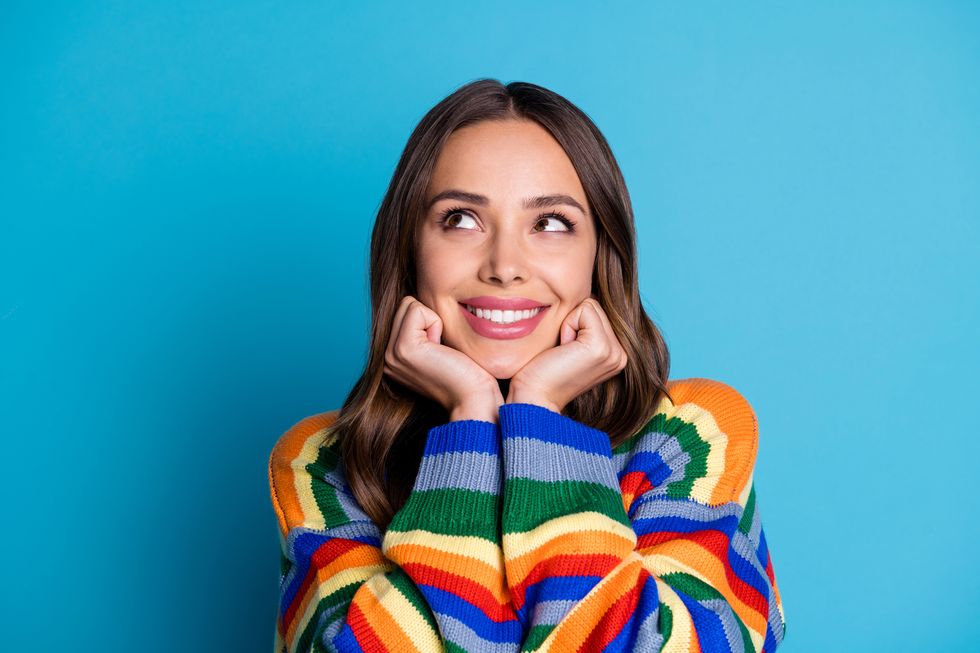 cheerful cheery brown haired lady overthinking solution clue guess isolated bright vivid shine vibrant blue color background