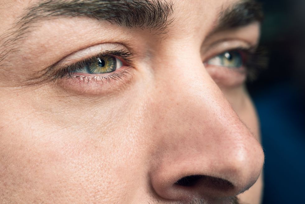 Close-Up Portrait Of Man With Hazel Eyes