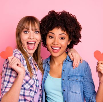 galentine's day captions two friends holding paper hearts
