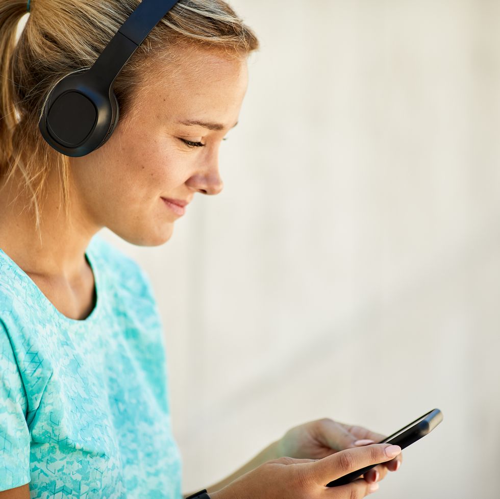 close up view of a young argentinian women using a mobile music app