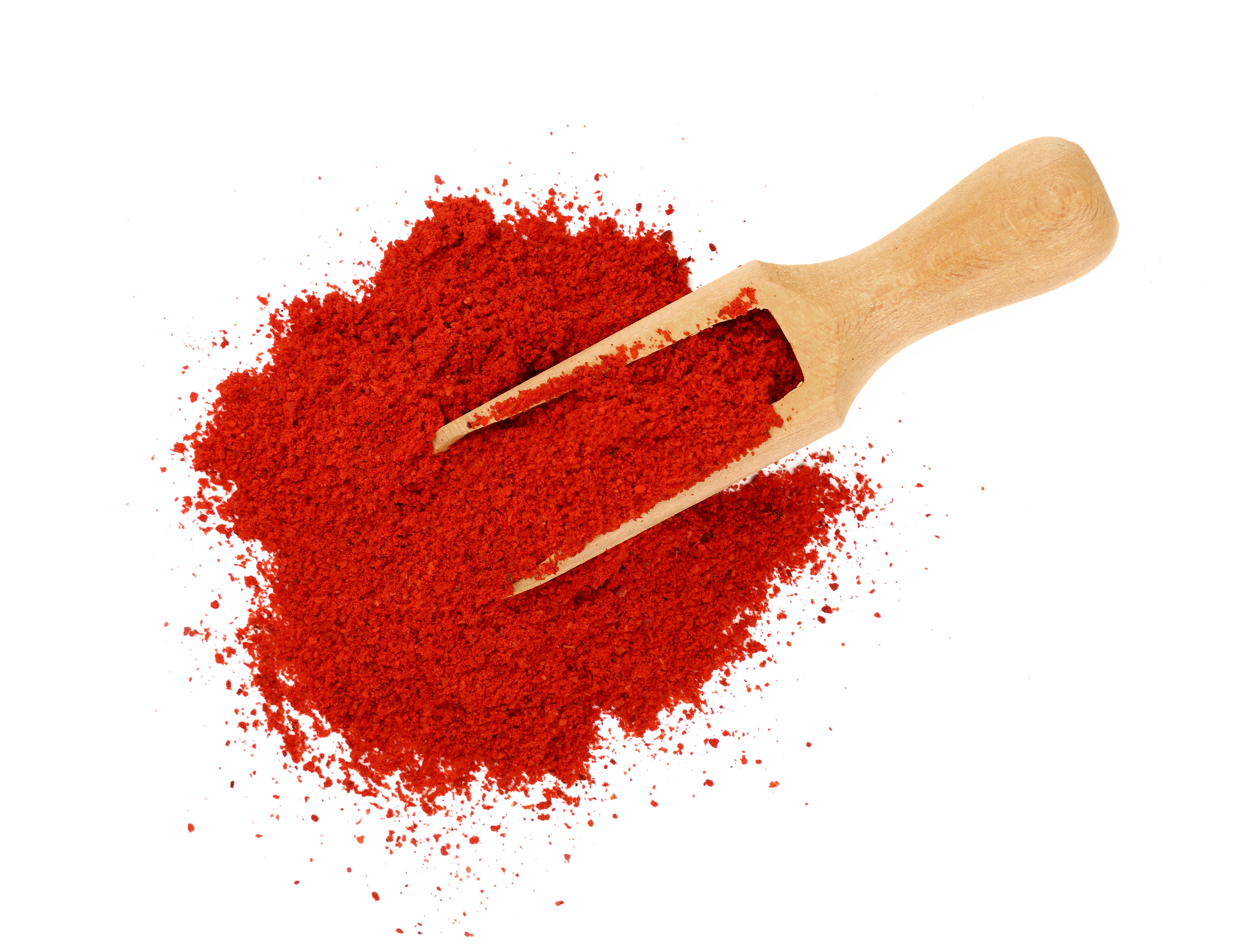 Close-Up View Of Red Chili Pepper Against White Background