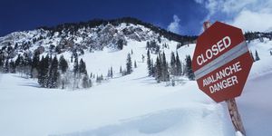 closed avalanche danger sign on slope