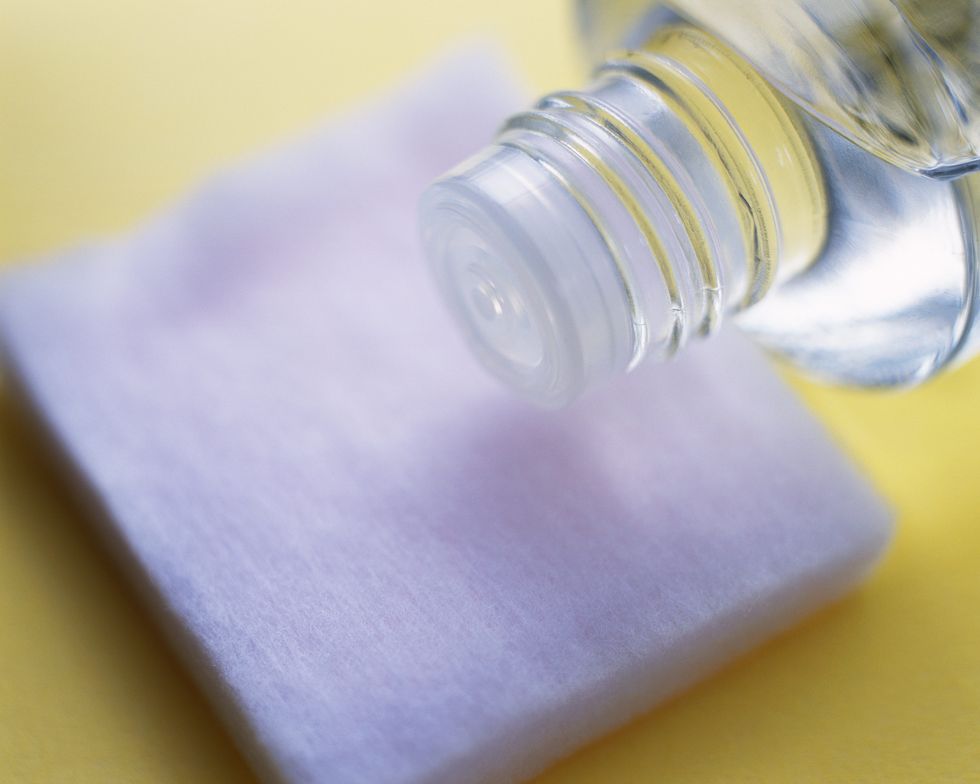 closed up image of a cotton and face lotion, differential focus