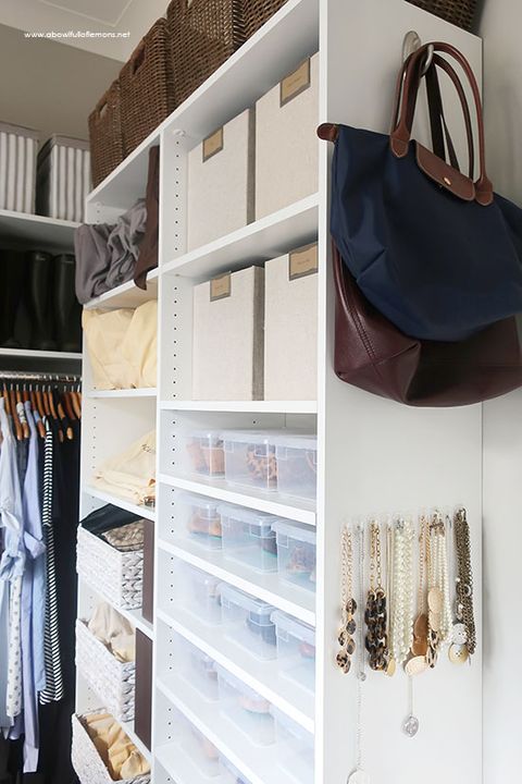 closet organization ideas, bags and necklaces hanging from hooks on the side of a closet system