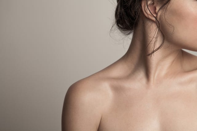 closeup of a profile of a young woman with long dark wet hair