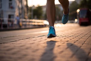 closeup of athlete feet in running shoes